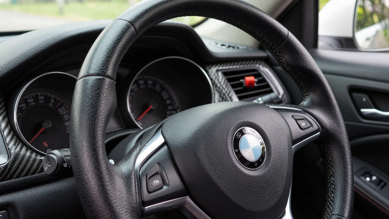 Black-dyed steering wheel with carbon fiber trim strips along dashboard vents.