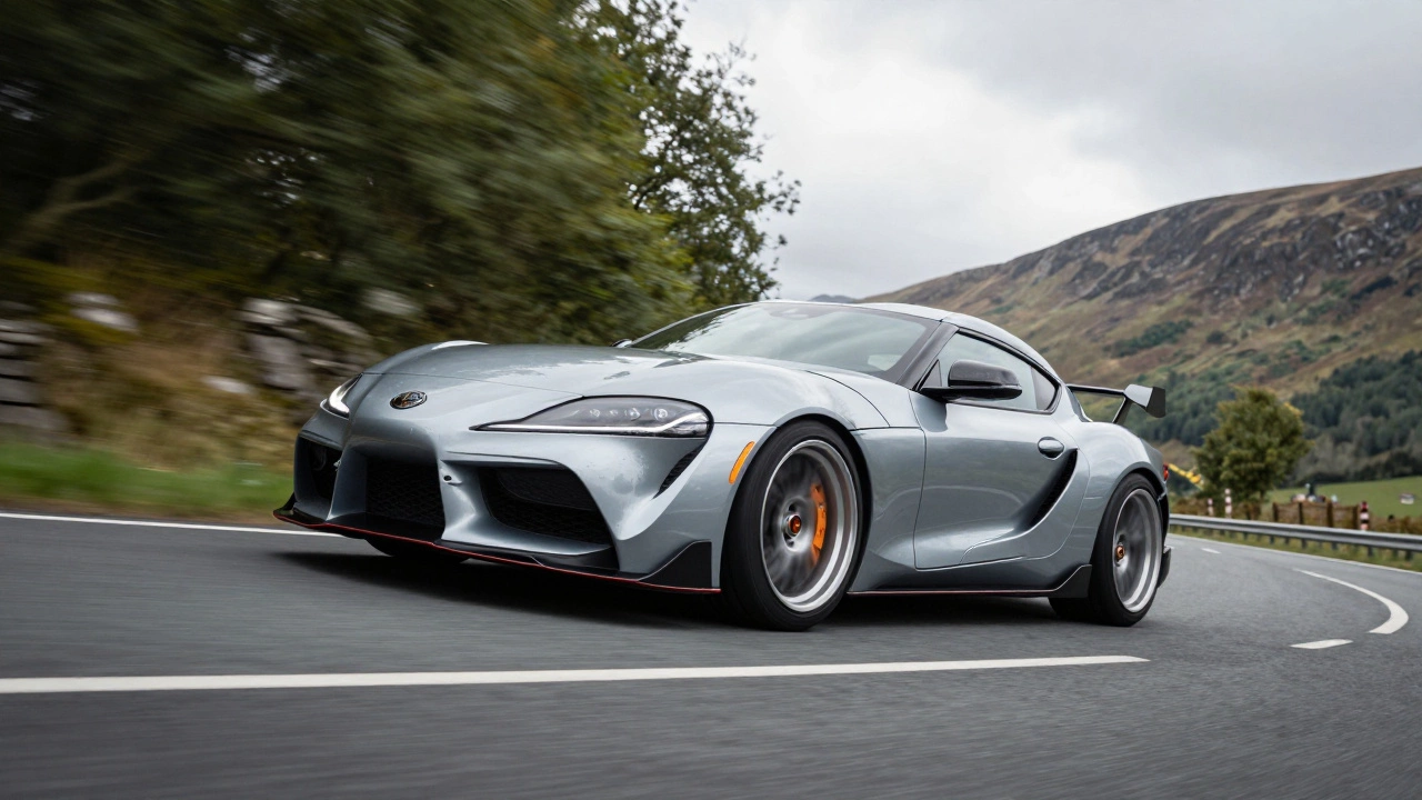 Lowered car with coilovers cornering on a winding UK mountain road