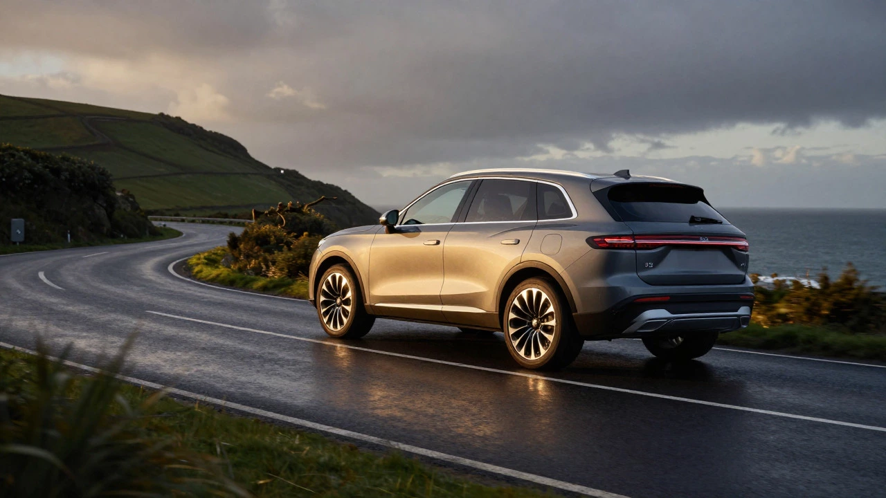 SUV with alloy wheels driving on a winding UK coastal road at sunset