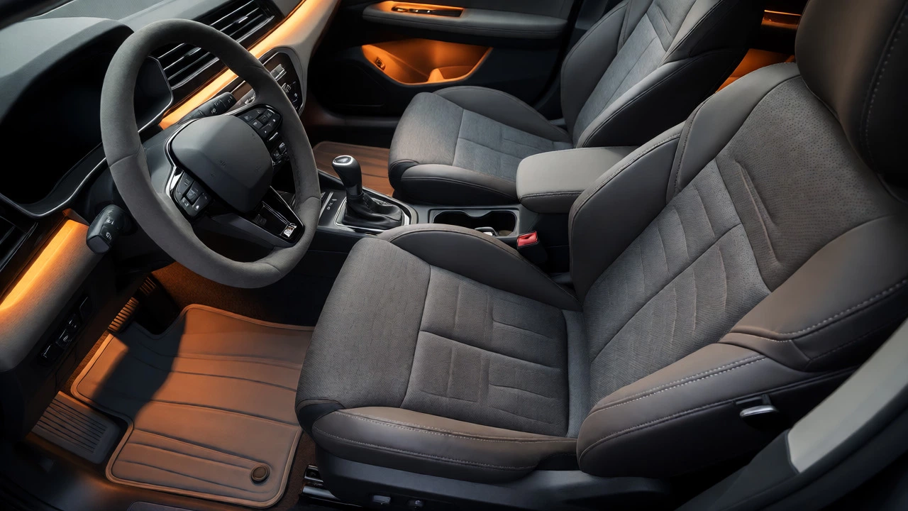 Car interior with tailored linen seat covers and warm ambient lighting